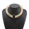 Gold chunky ribbed metal choker necklace with a central black oval stone detail. - Wide Snake Chain Choker (N13413)
