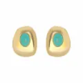 Detailed shot of irregular geometric gold stud earrings featuring vibrant turquoise stone. - E14541