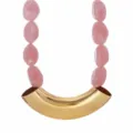 Chic statement choker necklace with pink resin beads and curved gold metal tube design. - Pink