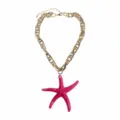 Close-up detail of the fashion summer beach style pink resin starfish pendant gold chain necklace. - Rose Red