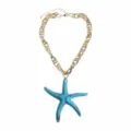 Close-up detail of the colorful resin starfish pendant necklace with chunky gold chain. - Blue