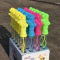 Detailed close-up view of colorful plastic pony-shaped bubble wands neatly displayed in box. - Pony Style / 1 Piece/Pack