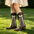 Detailed view of brown western cowboy boots with polka dot bows and pearl lace accessories. - Length: 15cm / Ivory Polka Dot