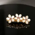 Elegant gold-tone flower hair clip featuring sparkling purple rhinestones for styling. - Style 9 Large Three Flowers with Purple Rhinestone