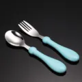 Stainless steel baby spoon and fork set with light blue handle for toddler feeding. - Blue