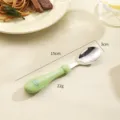 Stainless steel kids spoon with green silicone handle, 15cm length, cute cartoon design for baby. - Green Dinosaur Spoon