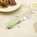 Stainless steel kids fork with cute green silicone handle and ergonomic toddler feeding. - Green Dinosaur Fork