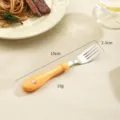 Kids stainless steel fork with orange soft silicone handle, cute cartoon design baby tableware. - Yellow Lion Fork