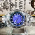 Men's carved quartz watch with blue circuit dial, luminous hands, and vintage engraved metal strap. - Stainless Steel Blue Dial