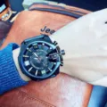 Oversized mens quartz watch with black dial and unique crown guard style variant. - Black Strap Black Case Gold Numerals