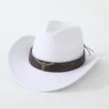Detail view of a white western cowboy hat featuring a brown studded leather band and bull skull. - M (56-58cm) / White