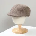 Close-up of a brown herringbone tweed flat cap, retro ivy newsboy hat detail view. - M (56-58cm) / Beret (CK-45) / Khaki