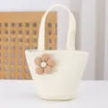 Close up of the woven straw texture and cute fabric flower detail on the mini handbag. - 17x14x6.5 / Cream