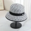 Classic black and white woven bucket hat for women, stylish sun protection straw hat. - M (56-58cm) / White