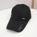 Detail view of the extended brim black baseball cap, showing metal SPORT logo and brim text. - Adjustable / Black