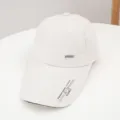 Extended brim baseball cap in white with metal sport logo and brim print for outdoor summer. - Adjustable / Beige