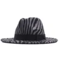 Detailed view of the stylish zebra print fedora hat with black ribbon bow decoration. - Adult (56-58CM) / Grey Zebra Print