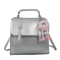 Sac à dos métallique argenté élégant avec porte-clés en peluche rose, sac de transport. - Avec Pendentif / Argent