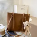 Brown PU leather tote bag for women with cute bear pendant, large capacity shoulder bag. - Bear / Tan