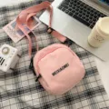 Leuke roze canvas schoudertas voor dames, veelzijdige studenten crossbody tas met handig vak. - Zonder hanger / Roze