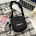 Black canvas crossbody bag for women, stylish Korean style shoulder bag with zipper and cute pendant. - Daisy Shoes Pendant / Black