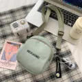 Canvas crossbody bag for women, cute single shoulder bag with trendy strap and letter print. - Daisy Shoes Pendant / Green