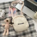 Ins style canvas crossbody bag for women, casual single shoulder messenger bag with cute bear pendant. - Bear / White