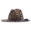 Close-up detail of the zebra print fedora hat, black leather belt, gold buckle, plush pom. - M (56-58cm) / Camel