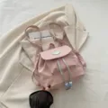 Joli petit sac à dos rose pour femme, cartable élégant avec cordon de serrage et rabat. - Rose