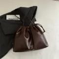 Stylish dark brown soft leather shoulder bucket bag for women, perfect for daily commuting. - Coffee