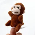 Cute brown monkey finger puppet plush toy for kids storytelling and fun interactive games. - Monkey