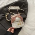White quilted mini crossbody bag with chain strap, camellia charm and chic silk scarf. - S / White
