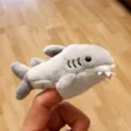 Plush shark finger puppet detail shot, soft material, cute animal toy for kids interaction. - Shark Finger Puppet