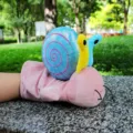 Cute plush snail hand puppet toy, pink body with blue shell, soft kids interactive doll. - Snail Hand Puppet