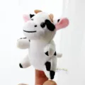 Cute cow finger puppet plush toy for kids, soft animal doll for storytelling and interactive play. - Cow
