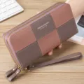 Detail view of the women long wallet, color-blocked PU leather clutch with double zippers. - Purple