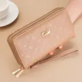 Elegant women's long wallet clutch with double zipper, stylish bow-knot decor and wrist strap. - Apricot