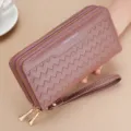 Close-up of a women's double zipper long wallet with chevron pattern and wrist strap. - Rouge Red