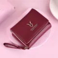 Compact women's PU leather tri-fold short wallet with zipper coin pocket and card holder. - Burgundy