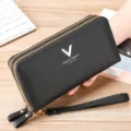 Elegant black long wallet for women with double zippers, spacious interior, and handy wrist strap. - Black