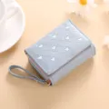 Blue short tri-fold wallet for women with cute heart embroidery and wrist strap compact size - Blue