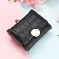 Black short wallet, crocodile pattern folding coin purse with clasp and round snap closure. - Black