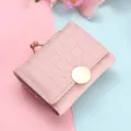 Pink short wallet with metal kiss lock and embossed texture, compact foldable coin purse. - Pink