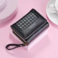 Women short tri-fold wallet in classic black color featuring grid texture and handy wrist strap. - Black