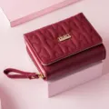 Women's short quilted wallet with zipper and wrist strap, compact card holder purse for daily use. - Red