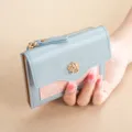 Women short PU leather wallet with snap button and zipper coin pocket, blue and pink design. - Blue