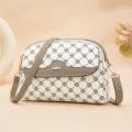 Stylish women's crossbody bag with chic monogram pattern and strap for casual daily wear. - White