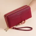Women's long double zipper wallet with wrist strap, minimalist pebbled PU leather clutch. - Red