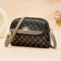 Stylish brown monogram crossbody bag for women, featuring a chic flap and adjustable strap. - Coffee