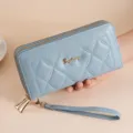 Light blue quilted long wallet for women with double zippers and wrist strap fashion clutch. - Blue